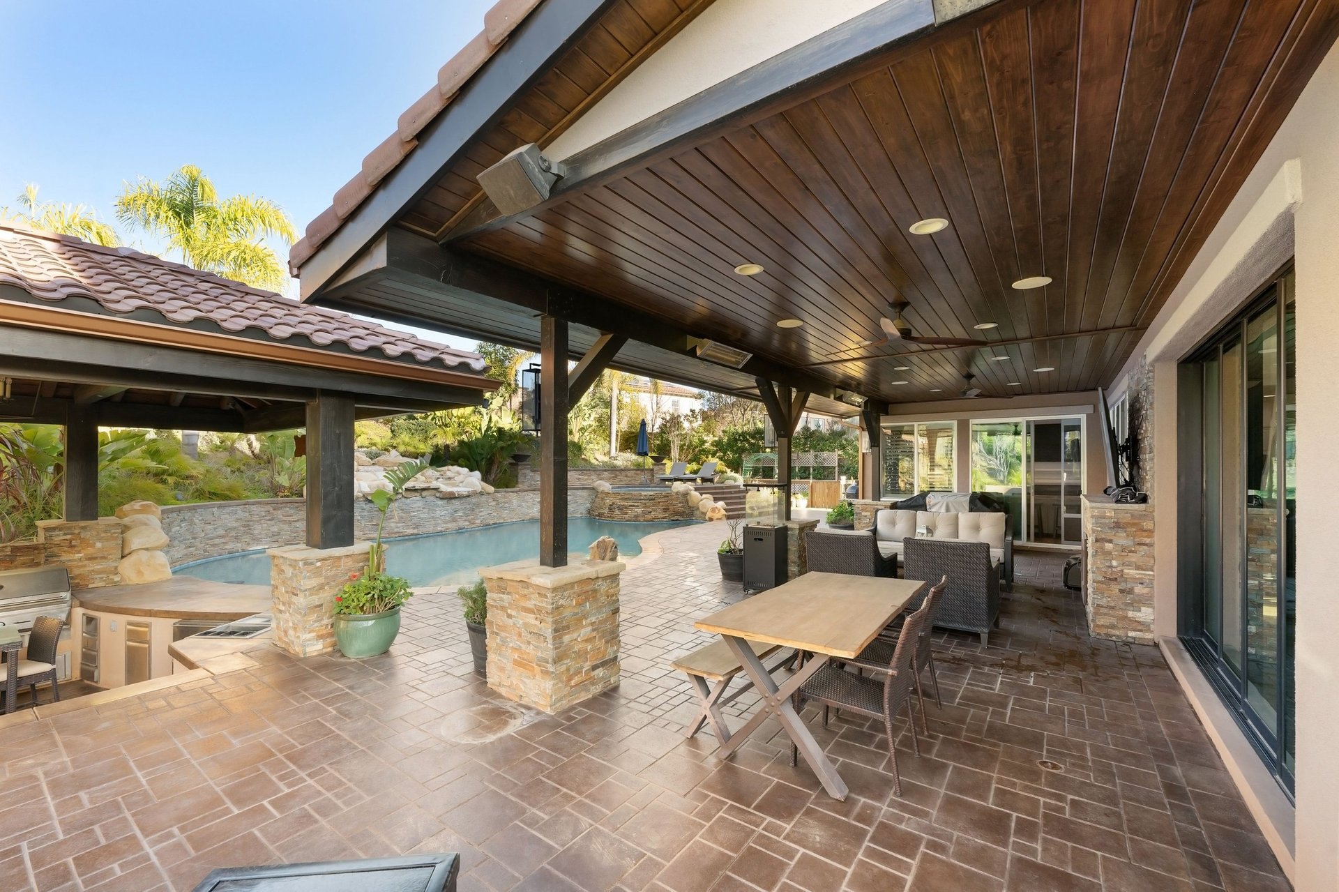 Luxury outdoor living space with patio and pool