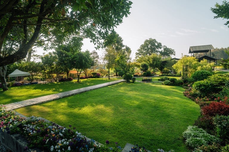 Landscaped garden with curved stone pathway and flower beds